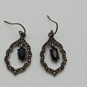 gold tone dangle earrings with black faux stone